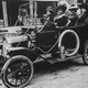A photograph of Sarah Breedlove (second from left) driving a car. She was better known as Madam C.J. Walker, the first woman to become a self-made millionaire in the United States, 1911. From the New York Public Library.